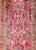 A beautiful early 20th century Persian Sarouk rug with a fantastic mirrored floral and vine pattern, expertly rendered, in...