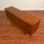 Vintage mid-century teak sideboard featuring clean Danish modern styling, slightly bowed front, sculpted teak handles and...