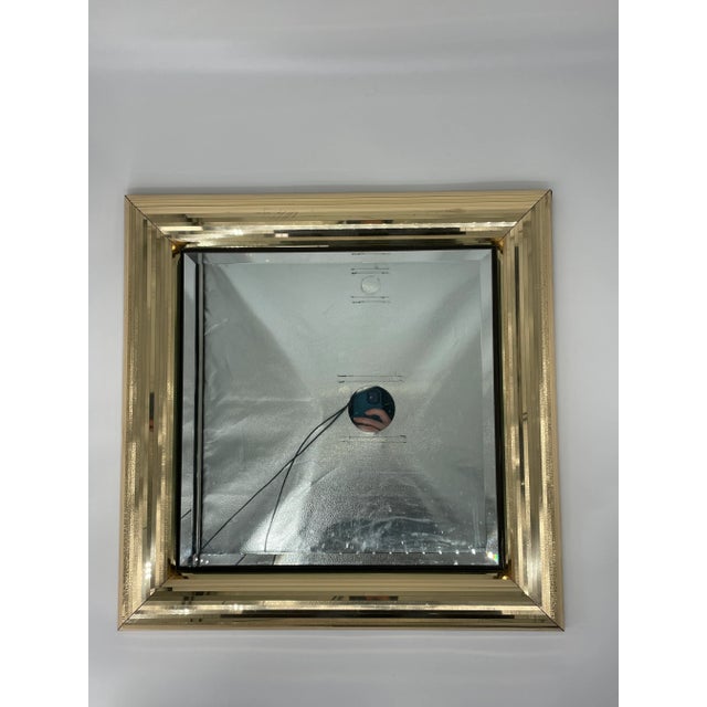 Golden Mirror in the style of Jon Gilmore for Accessory Art Studios of Huntington California. Most likely is a Gilmore but...