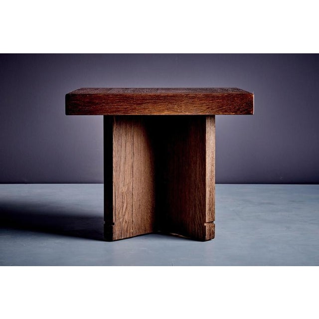 Elegant and robust pair of side tables in solid oak, crafted in France in the 1970s. Featuring a square top with visible...