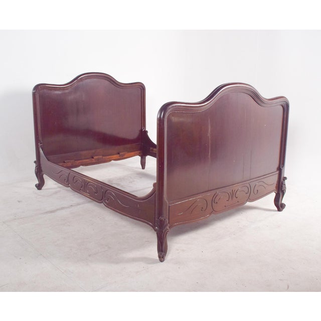 This French Louis XV style bed, sized for one and a half persons, is a refined example of 18th-century inspired design....