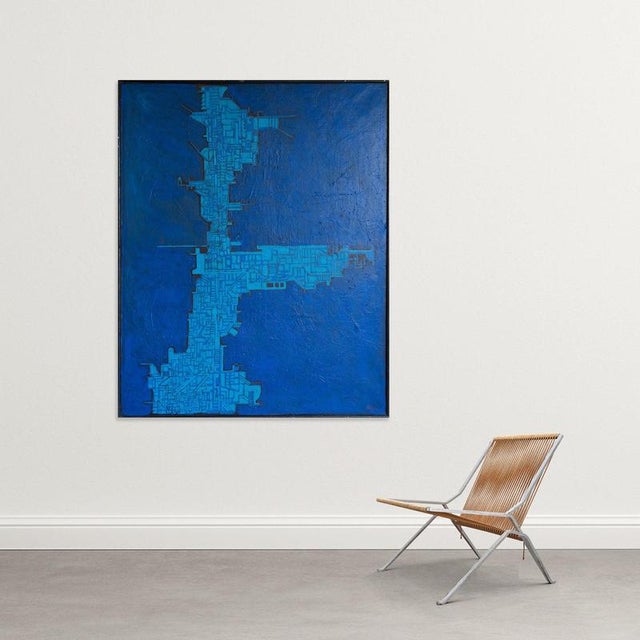 : This oil on canvas presents an abstract composition of a geometric nature, dominated by an intense range of blues that...