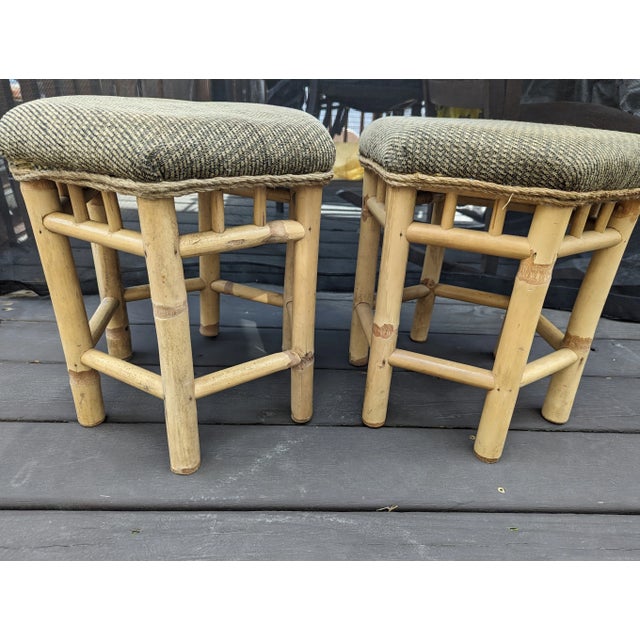 Vintage pair of heavy Rattan structure. It has all original coverings. . They have rope trim surrounding the top of each...
