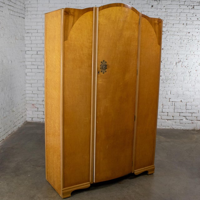 Handsome Early to Mid-20th Century Vintage English & Art Deco style large wardrobe, armoire, or storage cabinet composed...