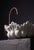 An extraordinary hand-carved vessel sink in solid Raj Nagar white marble, its scalloped rim shaped into soft, undulating...