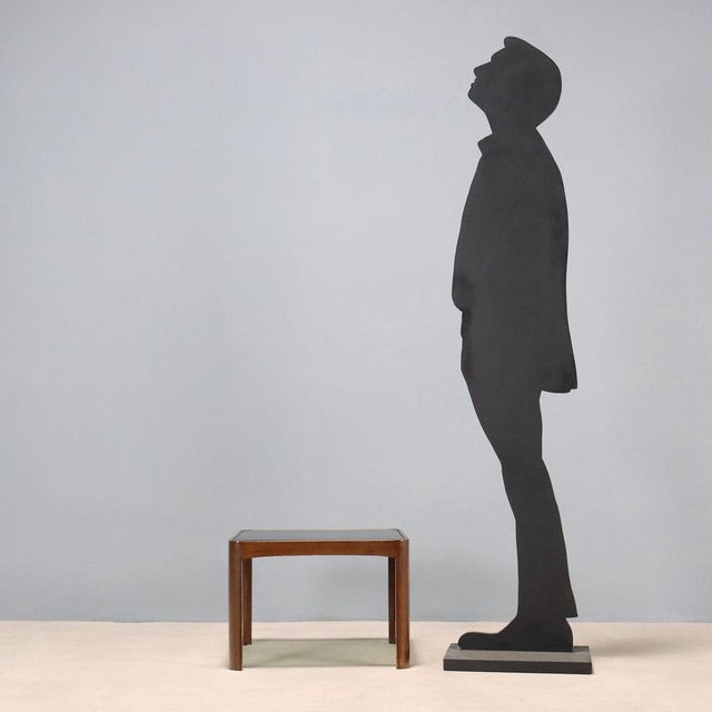 Coffee table in stained beech wood and smoked glass top. This piece is attributed to the mentioned designer/maker. It has...