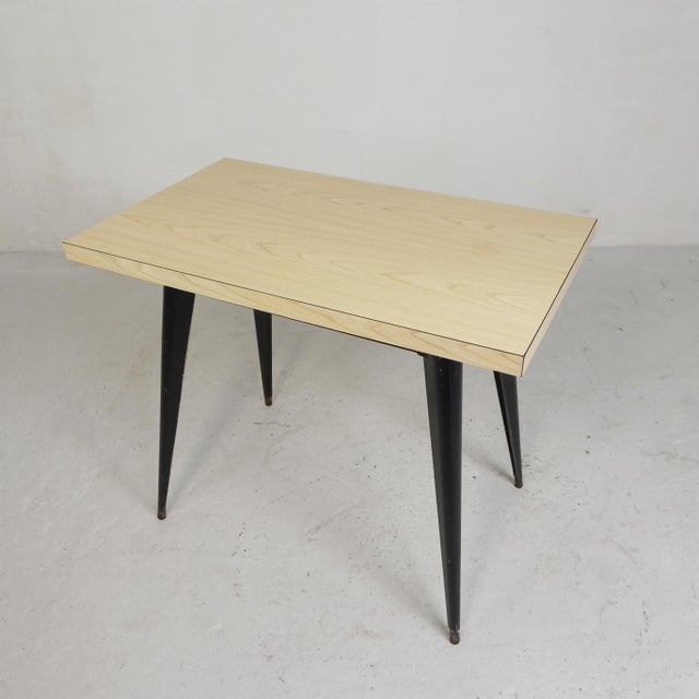 This table is an iconic French industrial design from the 1950s, created by Xavier Pauchard. The oldest models were made...