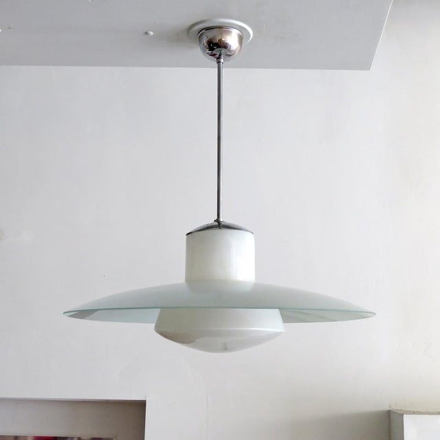 Wonderful opaline glass pendant by Kandem, Germany, 1930, suspended from nickel plated rod and canopy with large frosted...