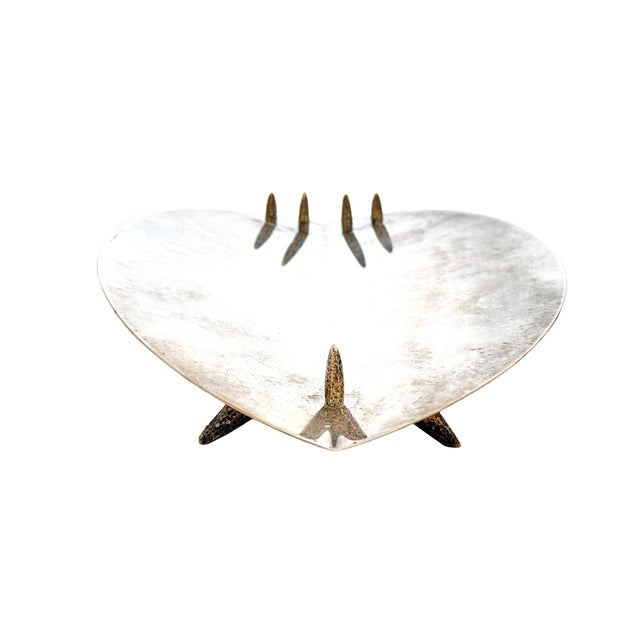 A striking, elegantly unusual silverplate centerpiece bowl by Cassetti. A handmade modernist design with an elusive form...