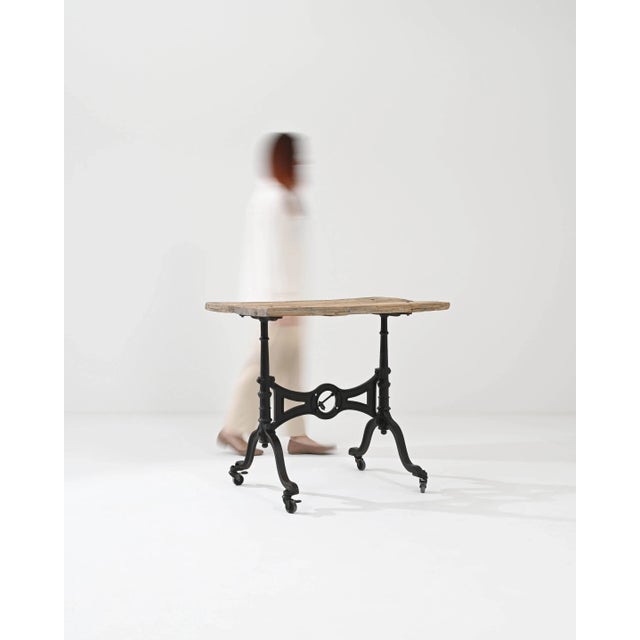 This bistro table provides a charming and idiosyncratic vintage piece. Made in France at the turn of the century, a metal...