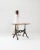 This bistro table provides a charming and idiosyncratic vintage piece. Made in France at the turn of the century, a metal...