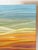 A more contemporary abstract approach to a landscape painting, the artist has painted swathes of colors from the rainbow...