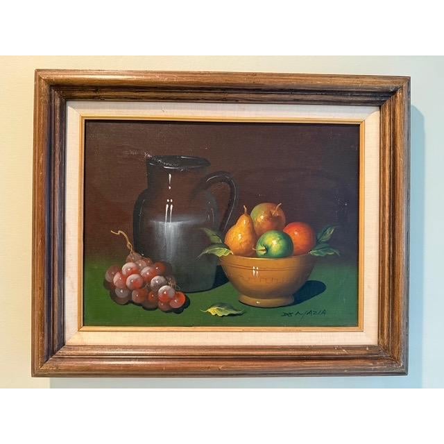 A handsome mid-century tabletop still life oil painting on canvas bearing the signature 'De Mazia'. Rendered in the rich,...