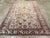 An antique Turkish Oushak accent rug. The old ivory field of this attractive west Turkish carpet has a bilaterally...