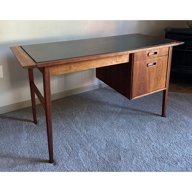 Vintage 1960’s slate top walnut desk by Jack Cartwright for Founders. Beautiful, solid wood desk. Features two drawers to...