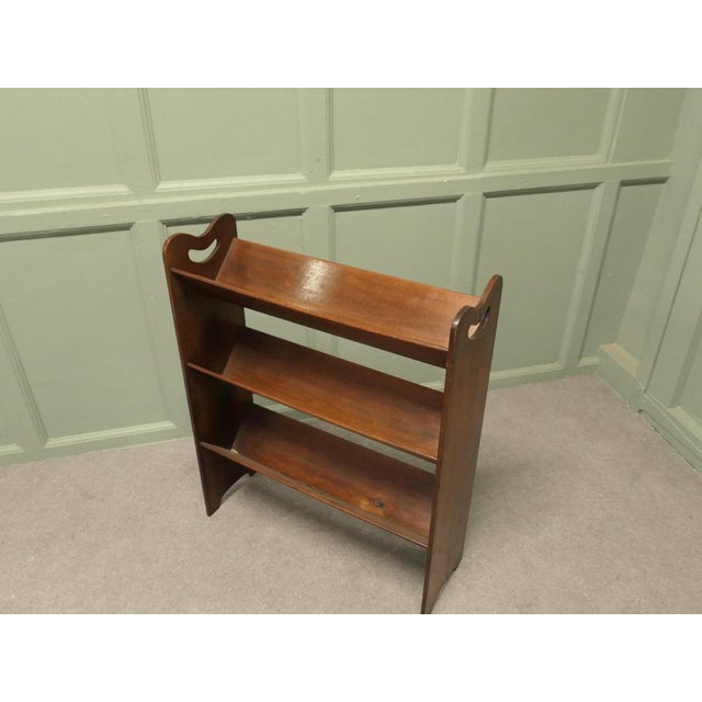 Arts and Crafts Open Front Slope-Shelf Book Trough This bookcase has 3 open trough shelves and has carved hand holds at...