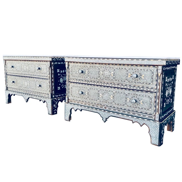An extraordinary pair of late 19th-century Syrian nightstands, handcrafted in Damascus, Syria, and distinguished by...