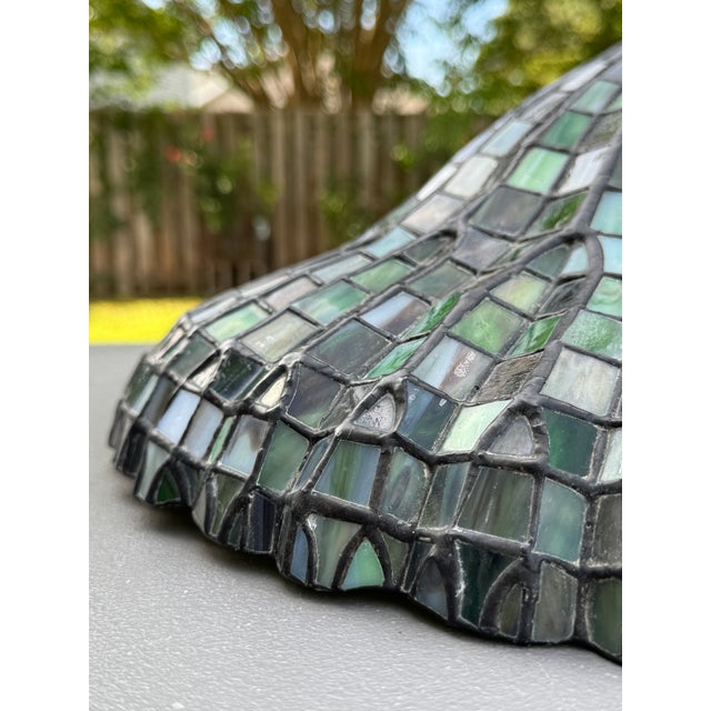 Offering for sale this exquisite Tiffany-style leaded green slag glass lotus lamp shade with the following fine features:...