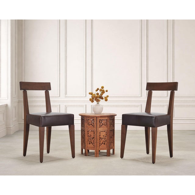 An elaborate Moorish style carved hardwood round drinks table, or side table, featuring a richly carved top over an...