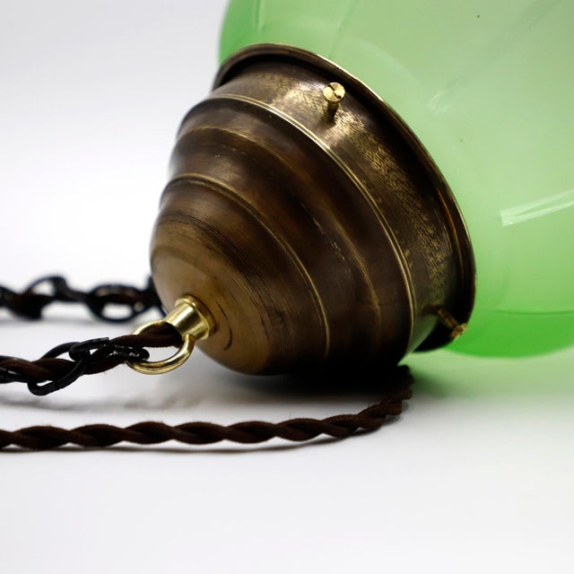 Circa 1930. We offer this Art Deco Pendant Light in Rare Green Opal Glass and Brass, Absolutely a very rare and difficult...