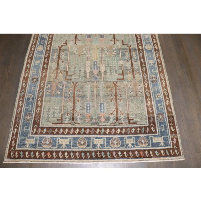 an early 20th Century Persian Malayer Rug with a willow tree design