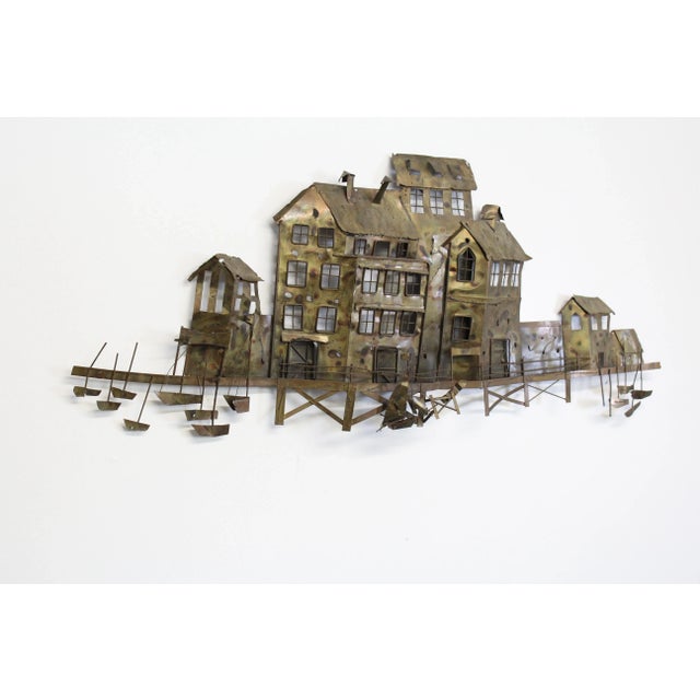 Jere Style Mid-Century Waterfront Scene Metal Wall Hanging Offered is a beautifully unique, Jerè style wall hanging. It is...