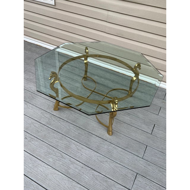 Gorgeous Brass Horse Head Coffee table in really good vintage condition This coffee table has a matching console table,...
