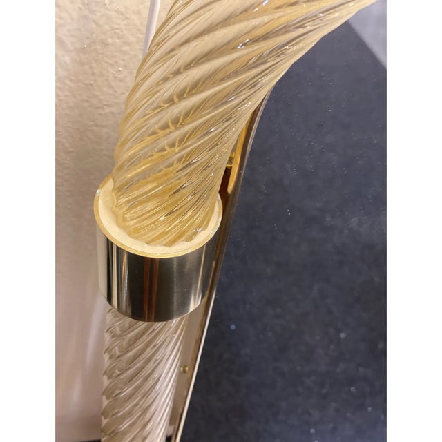 Rectangular gold “Torciglione” Murano Glass Wall Mirror. Scenographic wall mirror in brass elements with trasparent ando...