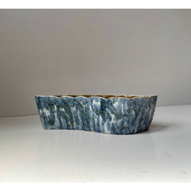 Mid century glazed ceramic ikebana bowl or vase. The glazes spands from okra brown, blue, light blue, grey and white....