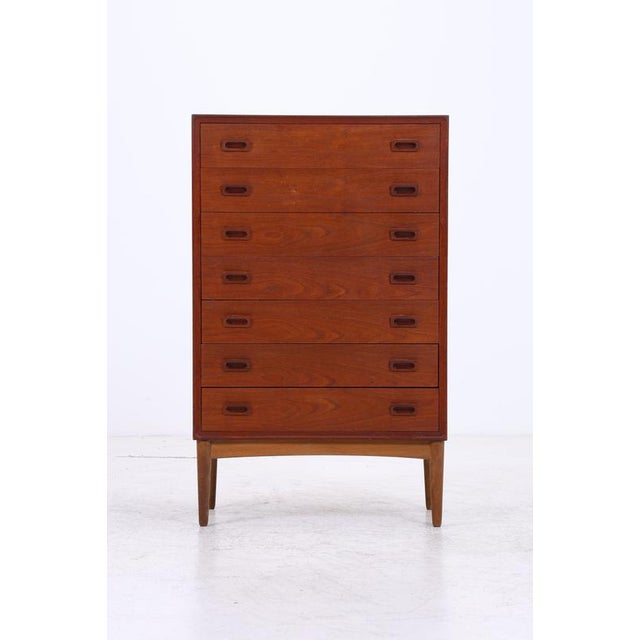 Vintage tallboy cabinet with seven spacious drawers and striking recessed handles. The clean lines of the front, the...