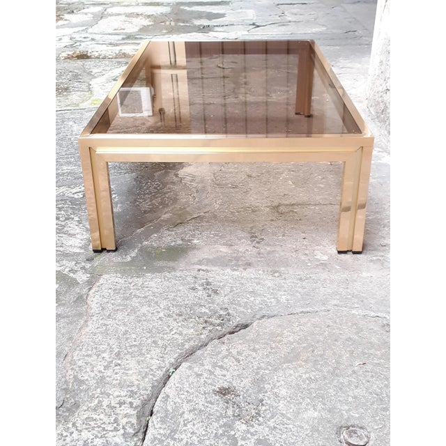 1970s Italian-made brass coffee table, beautiful dimensions: 130 x 75 cm, height 33 cm. The glass is still the original...