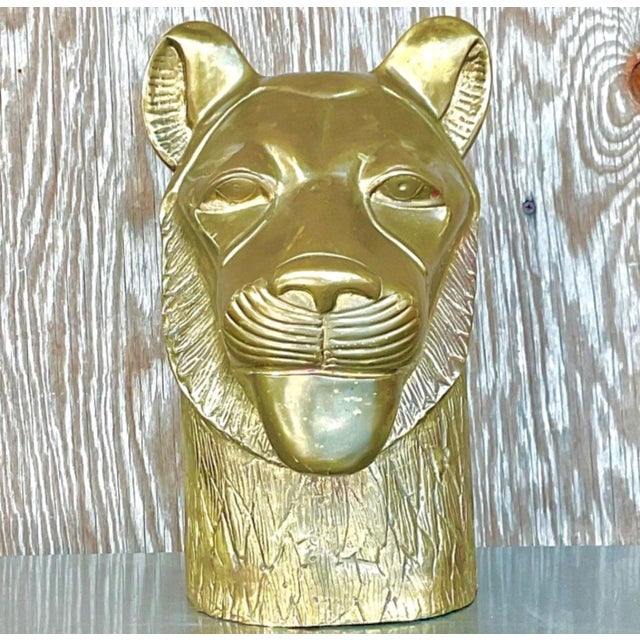 This vintage brass tiger head sculpture is a powerful decorative object that captures the commanding presence and...