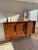 A particularly rare Bramin highboard from the 1960s with a trapezoidal body. The frame, edges, and legs are made of...