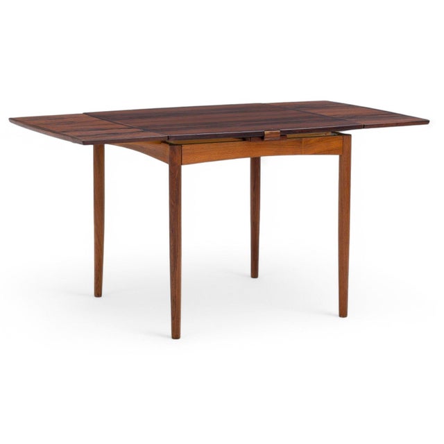 Origin: Denmark Designer: Arne Wahl Iversen Manufacturer: Aage Pedersen Era: 1960s Materials: Rosewood Measurements: 31.5"...