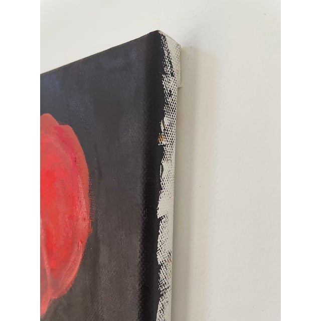 Bright red geranium on black-brown ground. Nancy’s Bio: Nancy challenges her creativity by painting large oil landscapes,...