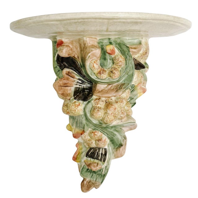 Elevate your wall decor with this vibrant pair of ceramic wall shelves (wall brackets). Designed with a lush, three-...