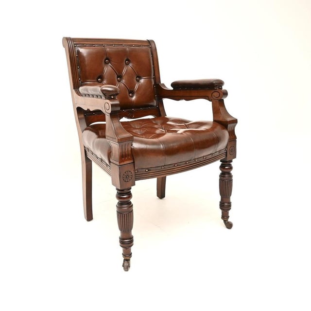 A superb antique Victorian Leather backed Library desk chair. This was made in England, it dates from the 1870-1890...