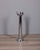 Cylindrical floor-standing ashtray in chromed metal, with cigarette extinguisher, Italian design, 1970s.