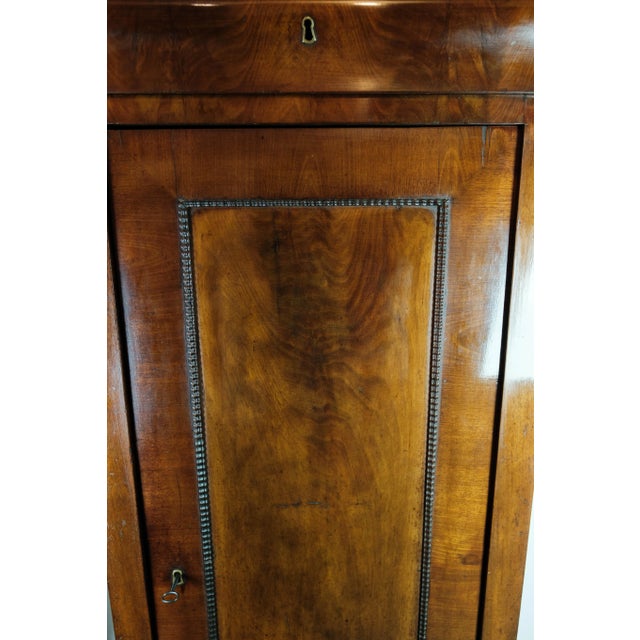 Late Empire tall cabinet of dark polished mahogany, in great antique condition from 1840.