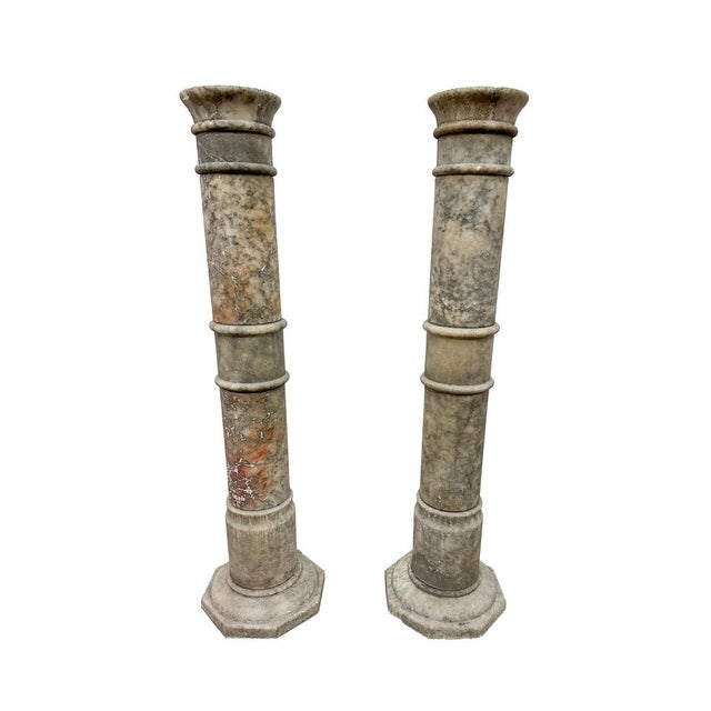 A pair of beautifully proportioned Victorian Marble Columns with one featuring rich veins of red & orange and the second...