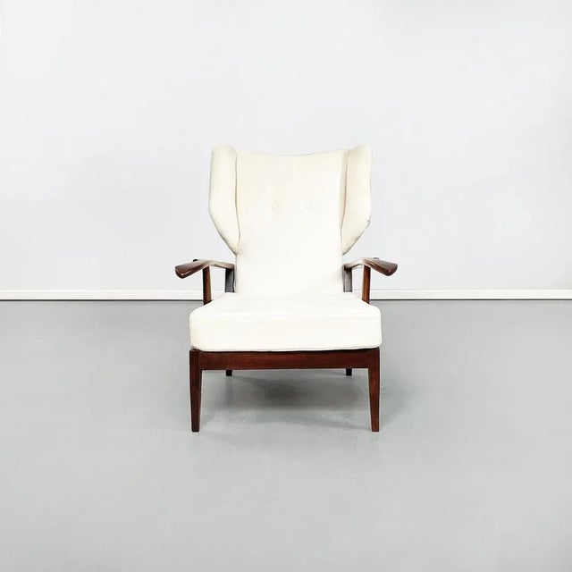 Italian mid-century white fabric and wooden armchair by paolo buffa, 1950s armchair with wooden structure. The seat is...