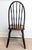 This chair, estimated to be from the late 19th century or early 20th century is an English-inspired Windsor chair in the...