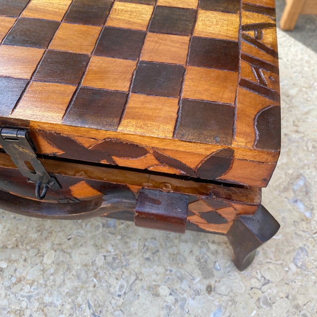 Incredible handcarved wooden footed chess game box. Pieces are individually handcarved as well. Perfect for any tabletop,...