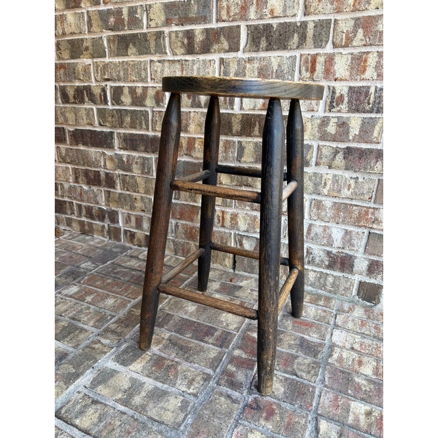 A charming vintage rustic stool with classic farmhouse character. This counter-height piece stands approximately 24″ tall...