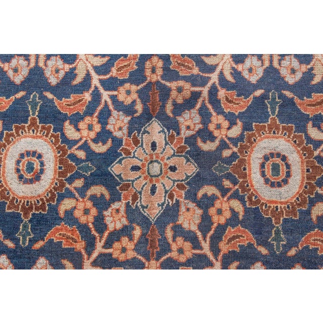 A late 19th century Persian Meshad (Meshed) antique rug, the oatmeal field with a trellis of enlarged palmettes and...