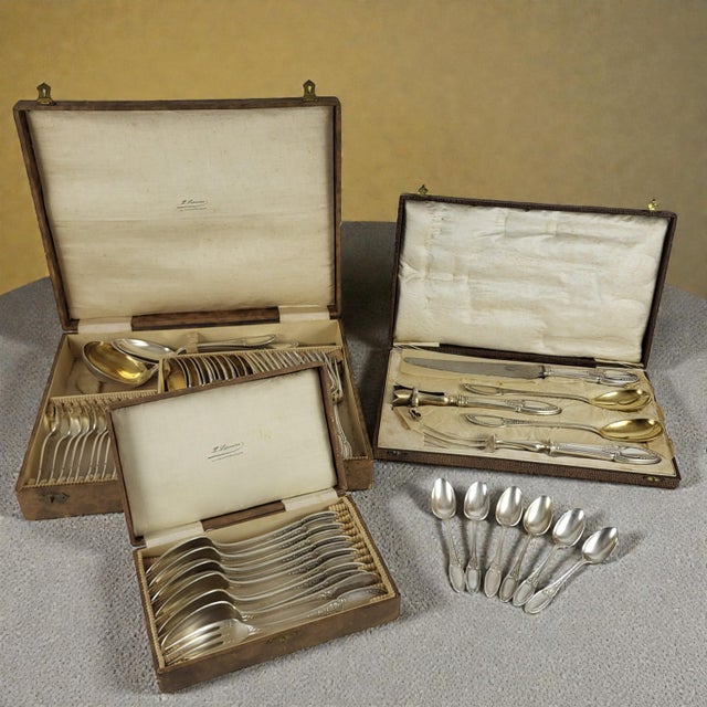 61-piece silver-plated flatware set by Ercuis, Empire pattern. This set includes: - 1 complete flatware set: 12 forks...