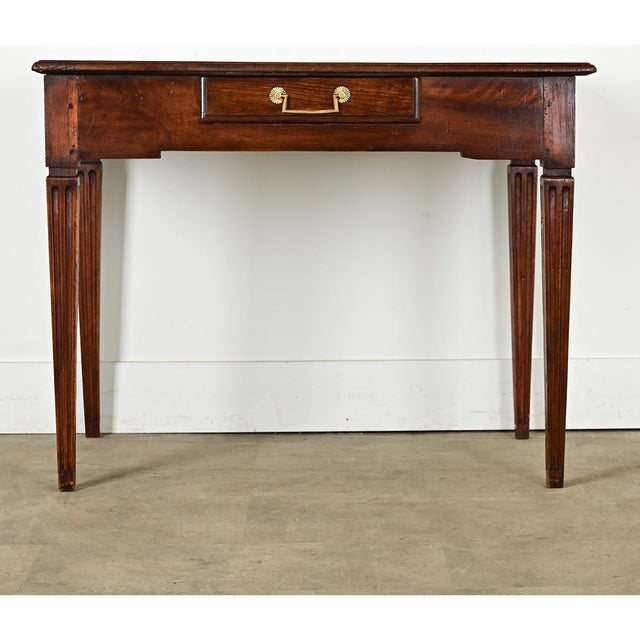 Dimensions: 28 ¾” H x 37 ¼” W x 24 ½” D Petite, French console table or writing desk from circa 1840, made of solid...