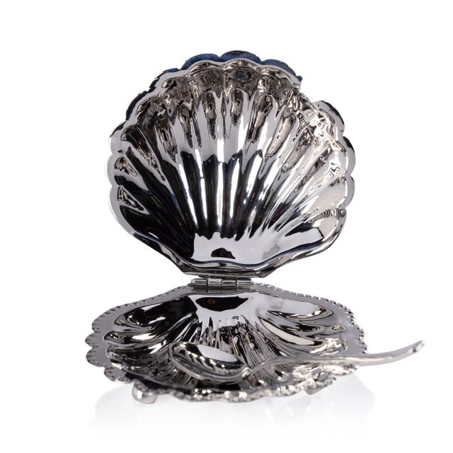 This exquisite clam shell-lidded bowl features a footed base and is crafted from food-grade brass with a shiny polished...