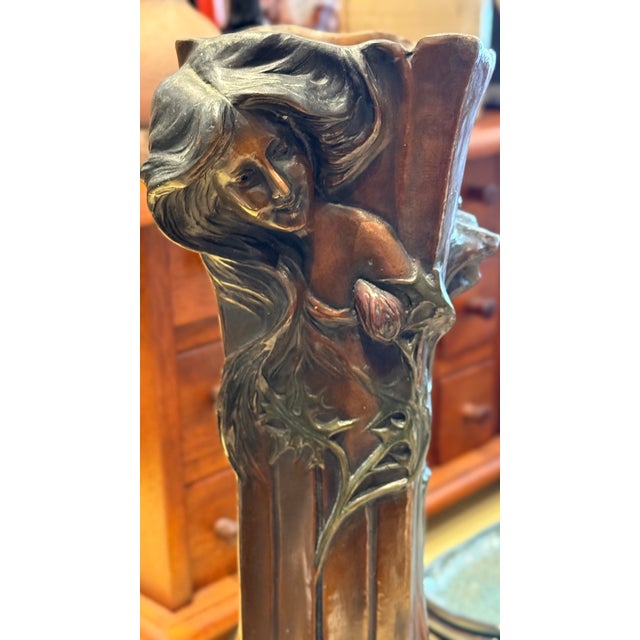 Elegant early Art Nouveau bronze vase attributed to Francesco Flora, featuring a beautifully modeled maiden surrounded by...