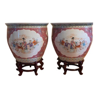Mid-20th Century Chinese Ruby Ground Famille Rose Fish Bowls on Carved Stands - A Pair For Sale